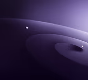 Abstract image depicting concentric dark purple rings with two small white cursor icons.