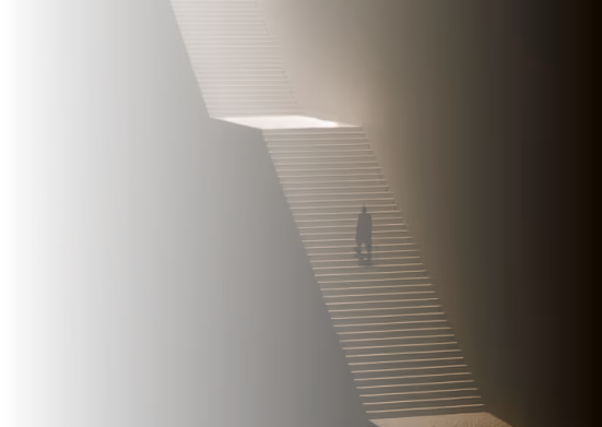 Silhouette of a person walking up a narrow, illuminated staircase in a dark, shadowy space.