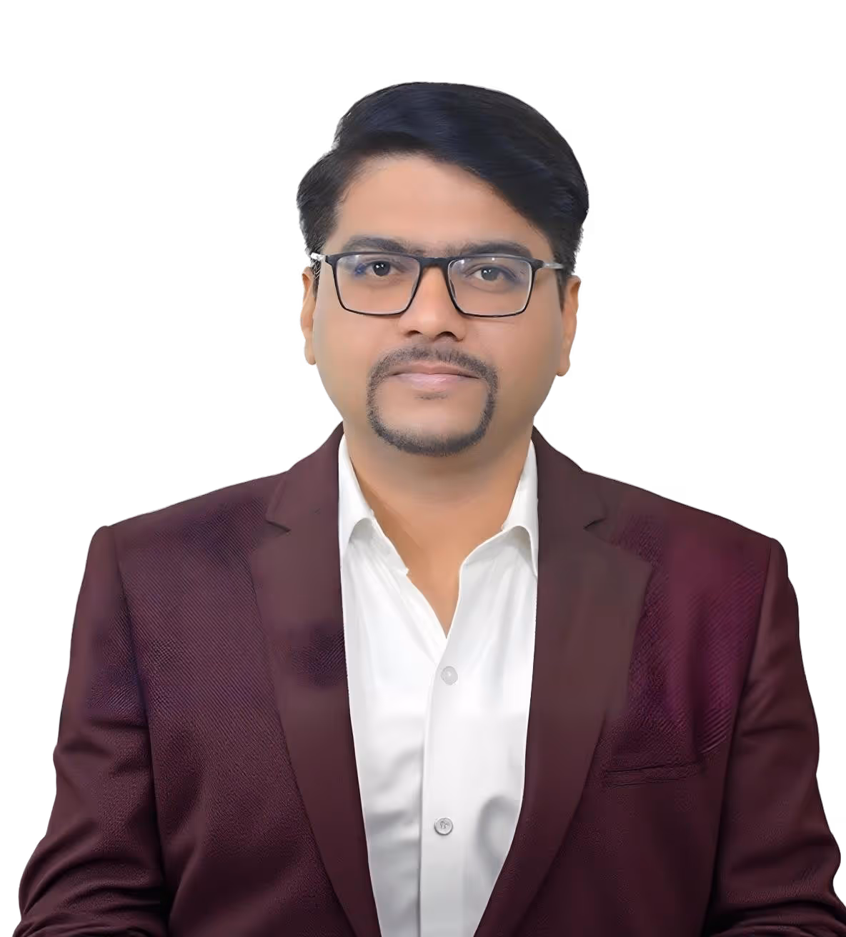 Man with glasses and trimmed beard wearing a white shirt and maroon blazer against a black background.