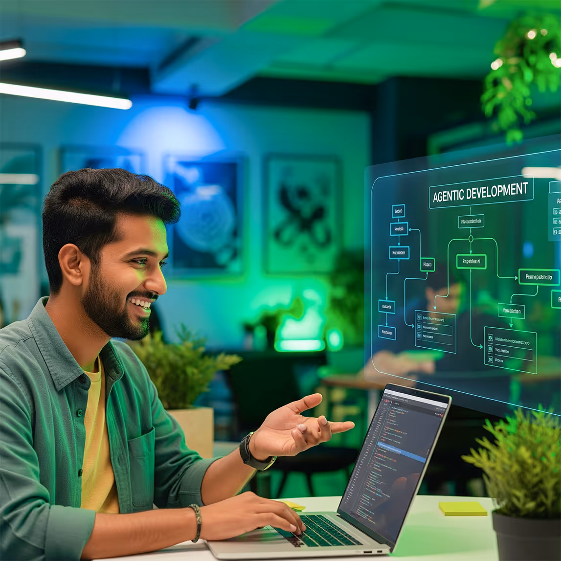 Smiling man working on a laptop with code on screen and a transparent digital flowchart titled 'AGENTIC DEVELOPMENT' in a modern office.