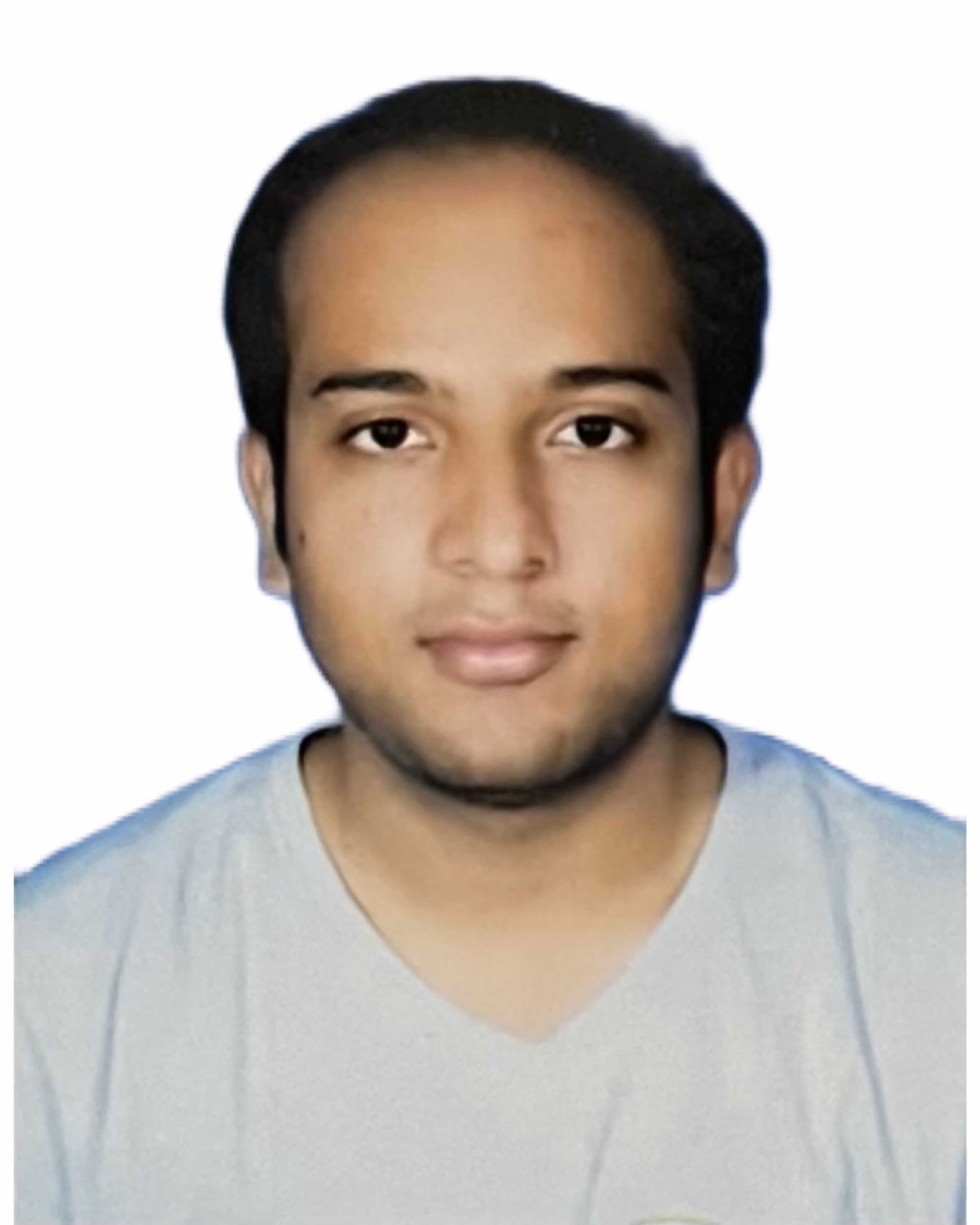 Portrait of a young man with short black hair wearing a light gray shirt against a plain white background.
