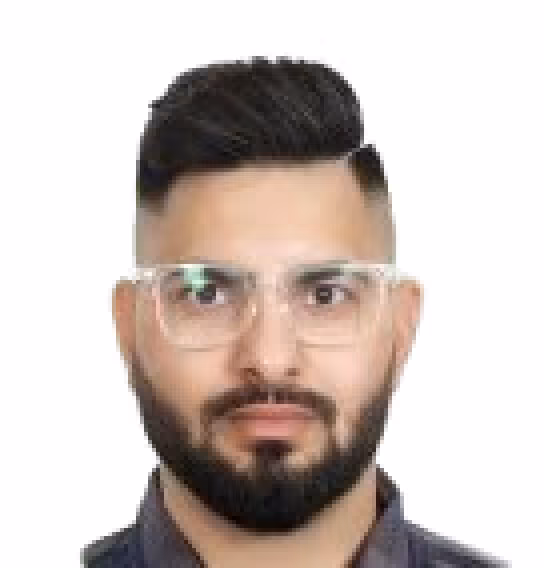 Man with dark hair and beard wearing clear-framed glasses and a dark shirt, against a white background.