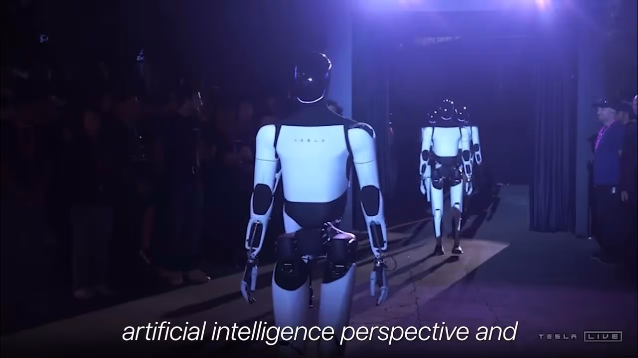 Two Tesla humanoid robots walking away down a dimly lit corridor during a live event.